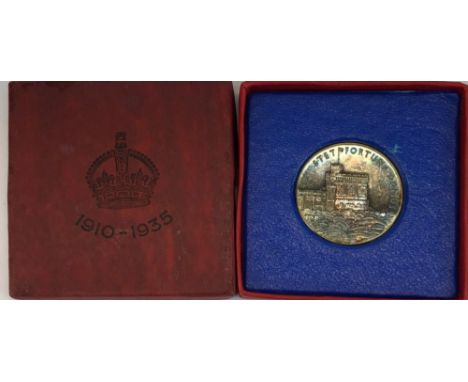 A 1935 commemorative silver coin for the silver jubilee of King George V and Queen Mary.