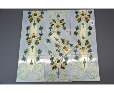 A set of tube-lined Chinese Yan Jin fireplace tiles, tile size 15 x 15cm.