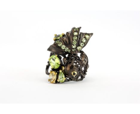 A 925 silver fantail fish shaped ring set with peridots and other stones, (N).