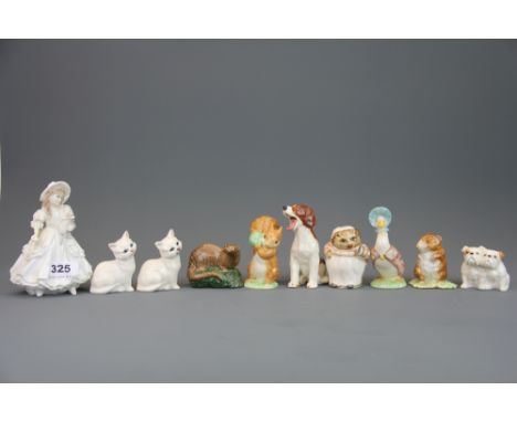 A Royal Worcester figure of a girl with a puppy, together with a group of Beswick, Royal Albert and other figures.