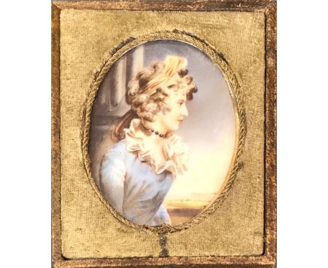 A framed hand painted portrait miniature on ivory of a young woman identified on the reverse as Mrs Bigfield, L. 12cm.