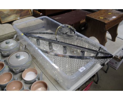 A decorative light fitting with prism drop decoration 