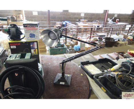 A metal angle poise lamp, sold as collectors item