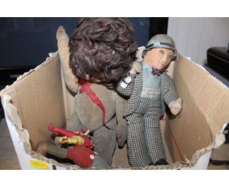 A box of vintage toys and a doll