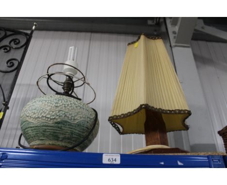 A pottery table lamp and a wooden table lamp and shade