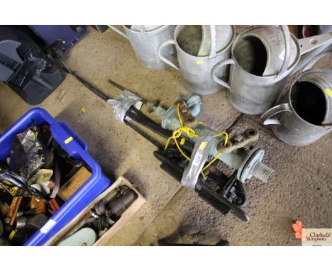A vintage hand water pump and brackets