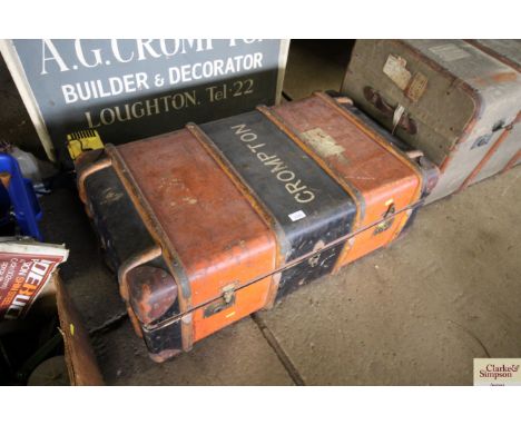 A wooden and metal bound canvas travelling trunk with internal tray