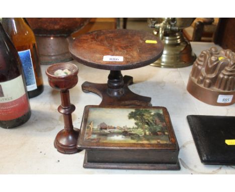 A miniature snap top table; wooden trinket box and single candle stick