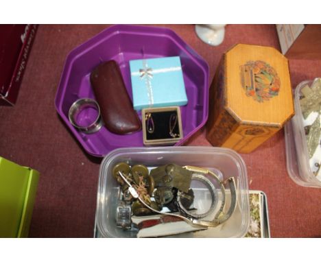 A wooden tea caddy; a box containing various jewellery; napkin ring; badges; buttons and wrist watches