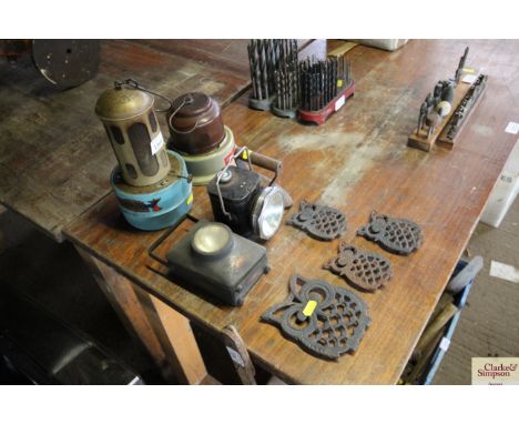 A Raydyot radiator; a Chalwyn heater; a Sunlight lantern; vintage iron and four trivets in the shape of owls
