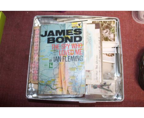 A box of ephemera including trade cards; postcards and James Bond The Sky Who Loved Me by Ian Fleming 