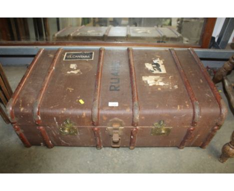 A wooden and metal bound travelling trunk