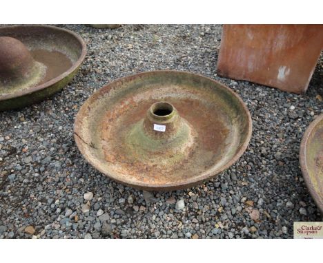 A circular cast iron pig trough AF, approx. 24' diameter