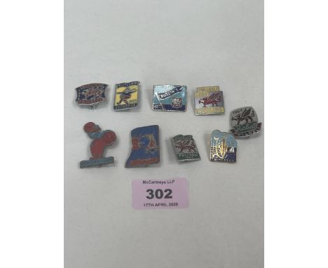 Nine vintage enamel Butlin's badges