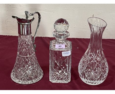 A cut glass claret jug with plated mounts, a cut glass decanter and a vase