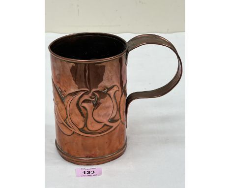 A 19th century Arts &amp; Crafts copper mug or measure, embossed with stylised foliage. 7" high