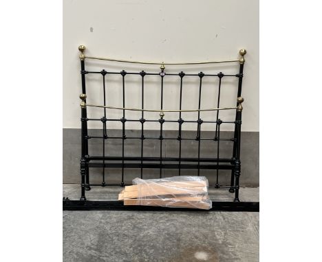 A 5' Victorian style iron and brass bedstead