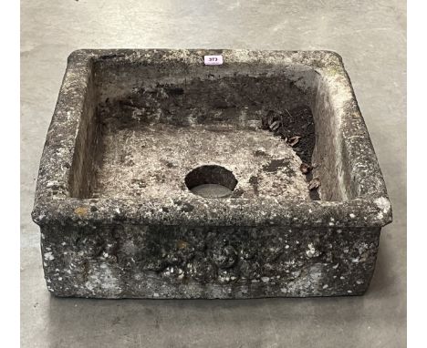 A garden sink with moulded decoration. 23" x 23"