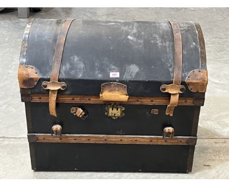 A canvas and metal bound cabin trunk with domed lid. 30" wide