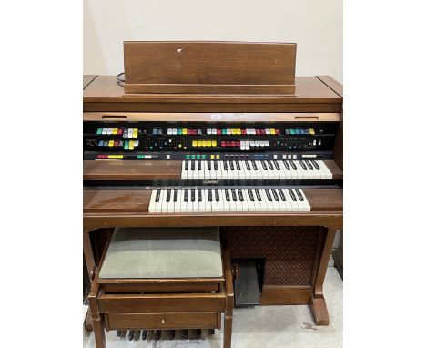 A Lowry Coronation 4 channel console organ with Magic Genie, to include a music stool. 48" wide