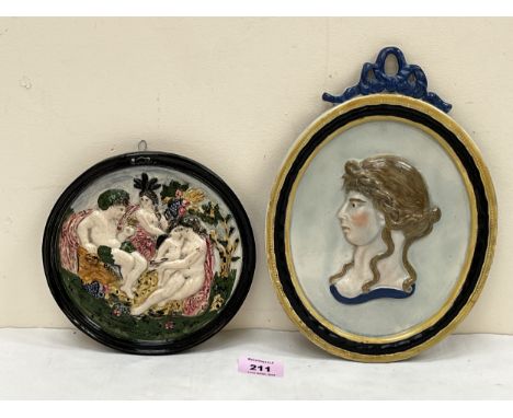 A 19th century ceramic plaque depicting a profile of Princess Charlotte 10½" high (restored) and a 19th century Bacchalian re