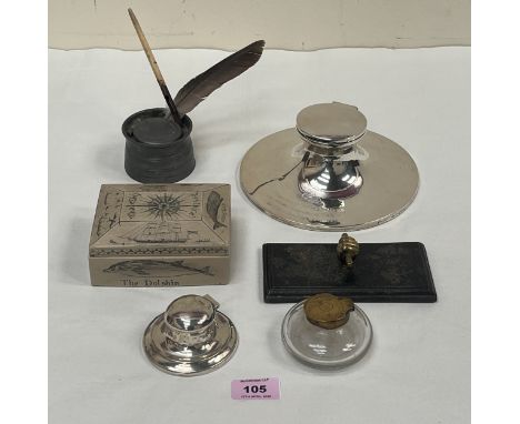 An Edward VII silver capstan inkwell, Chester 1910, 7" diam; a smaller silver example; a glass inkwell; another in pewter; de