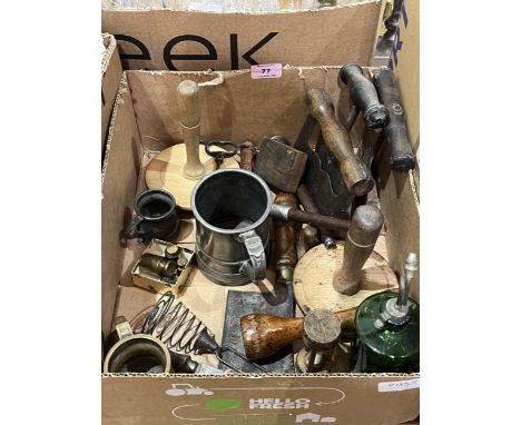 A collection of old kitchenalia with two pewter mugs, another in brass and four brass weights