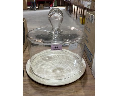A glass cheese dome with ceramic stand. 10" high