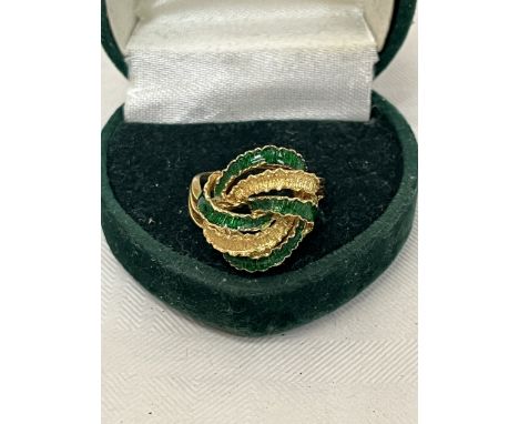 An 18ct green enamel ring. 5.8g gross. Size M