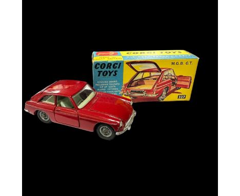 Corgi MGB GT dark red with light blue interior, wire wheels and black suitcase No. 327, generally excellent in excellent box.