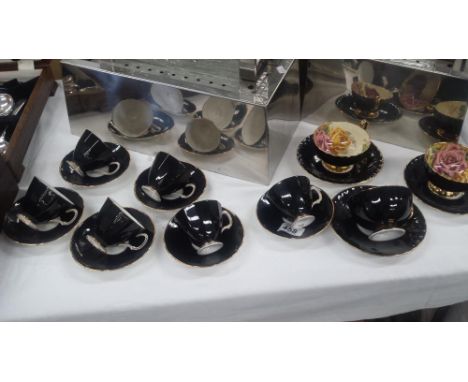 A Black Glazed Adderley Floral &amp; Aynsley Tea Cups And Saucers