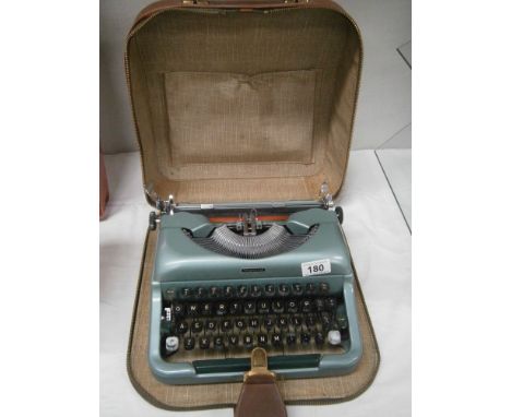 A portable typewriter.