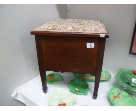 A mahogany commode with liner.