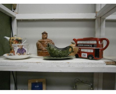 A shelf of pottery items inclduing Sylvac fish sauce bowl