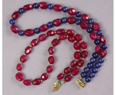 A necklace of alternating oval facetted ruby &amp; round sapphire beads, 18¾”; &amp; another of oval facetted ruby beads, 17½