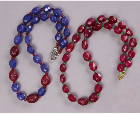 A necklace of facetted ruby beads, 19½”; &amp; another of facetted sapphire &amp; carved ruby beads, 18¾”.