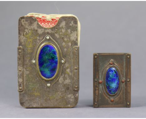 An arts &amp; crafts-style plated playing-card case inset blue &amp; green enamelled oval panel, 2¾” wide; &amp; a similar ma