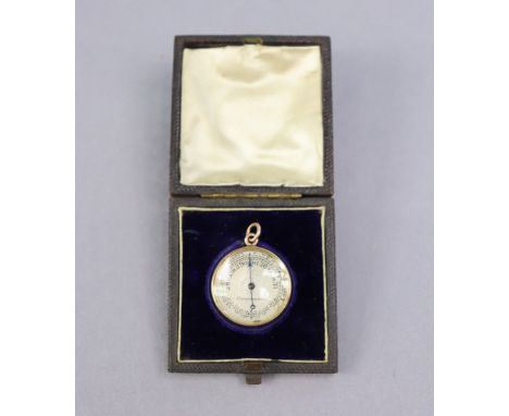 A late 19th/early 20th century gold-cased pendant aneroid barometer with 2.3cm engraved silvered dial, floral-engraved gilt m