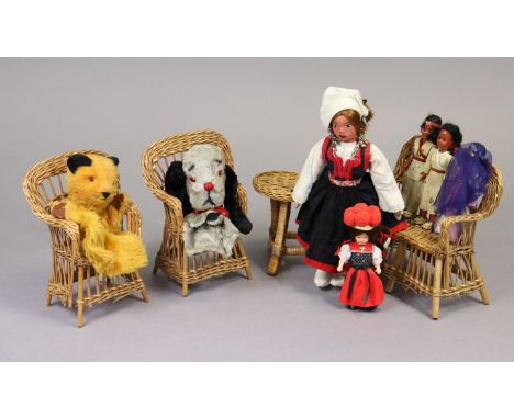 Two hand puppets- Sooty and Sweep, five various dolls, and a dolls wicker four-piece lounge suite.