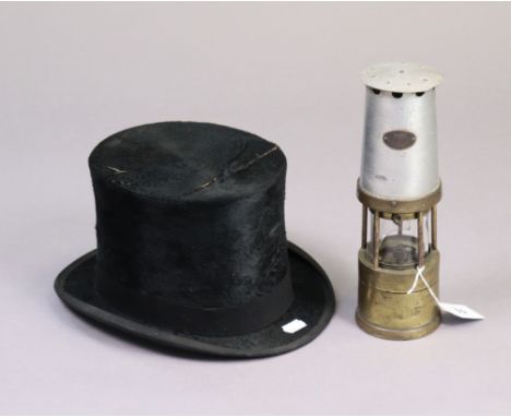 A Cadison brass &amp; steel miners’ lamp, 10½” high; &amp; a F. W. Fardells of Stratford black silk tophat (w.a.f).