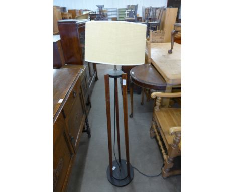 A teak standard lamp