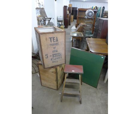 Two tea crates, a folding card table and a vintage step ladder