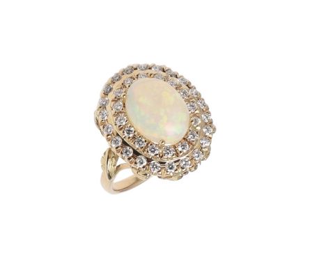 the oval-shaped solid white opal is set within a double surround of circular-cut diamonds, in 18ct yellow gold, with white an