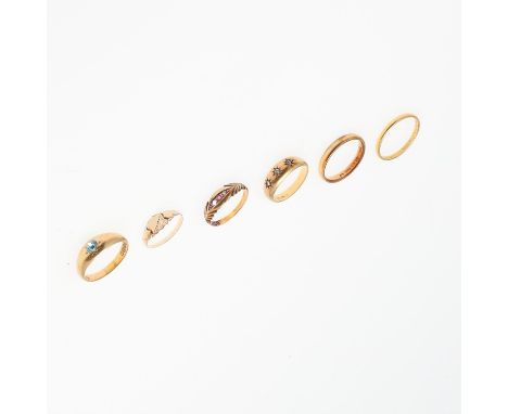 4.9 grams, size Q, together with another 22ct gold wedding band, 2.5 grams, size R 1/2, together with an 18ct gold and zircon