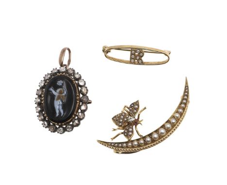 mounted overall with graduated half pearls, the butterfly set with a circular diamond, with ruby eyes, 4.0cm long, 5.1 grams,