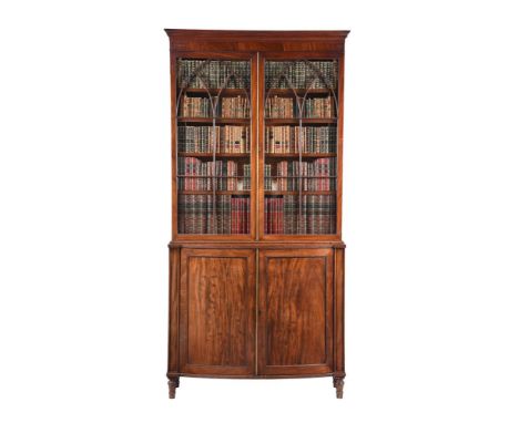 A GEORGE III MAHOGANY CABINET BOOKCASECIRCA 1800The glazed top above a base of bowfront outline with panel doors enclosing sh