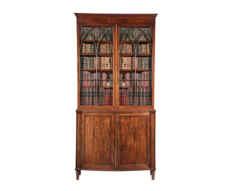 A GEORGE III MAHOGANY CABINET BOOKCASECIRCA 1800The glazed top above a base of bowfront outline with panel doors enclosing sh