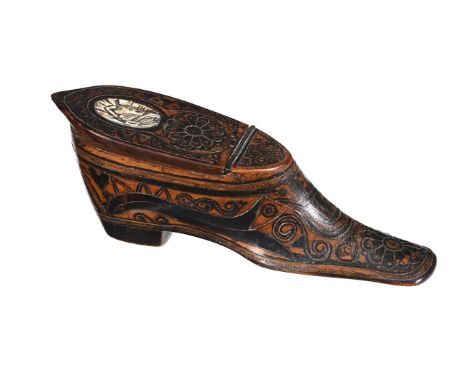 A BOXWOOD AND INLAID SNUFF BOX IN THE FORM OF A SHOE19TH CENTURYThe lid inset with a carved bone panel, the front and undersi