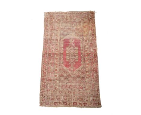 A GHIORDES CARPETMID 19TH CENTURYApproximately 333 x 161cmCondition Report: This carpet is heavily worn overall, there are th