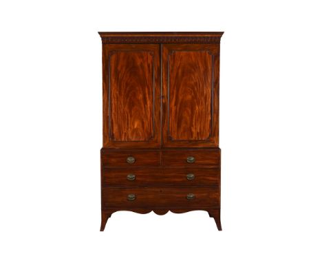 A GEORGE III MAHOGANY LINEN PRESSCIRCA 1780The panel doors enclosing slides, the base with two short and two long drawers204c